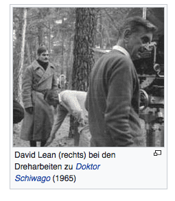 David Lean (rechts) bei den Dreharbeiten zu Doktor Schiwago (1965).png